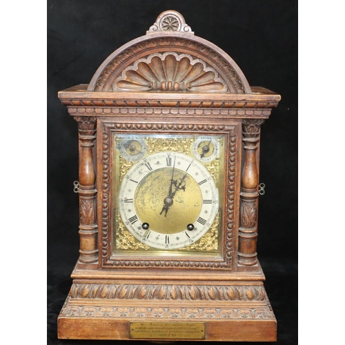 535 - A German W & H oak 8-day striking Westminster chime mantel clock with allover shell and leaf decorat... 