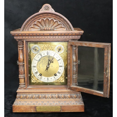 535 - A German W & H oak 8-day striking Westminster chime mantel clock with allover shell and leaf decorat... 