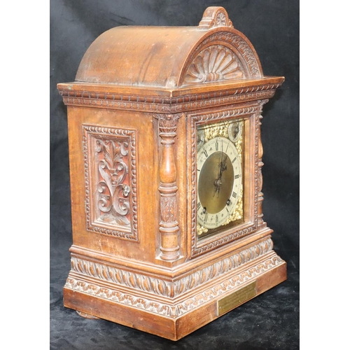 535 - A German W & H oak 8-day striking Westminster chime mantel clock with allover shell and leaf decorat... 