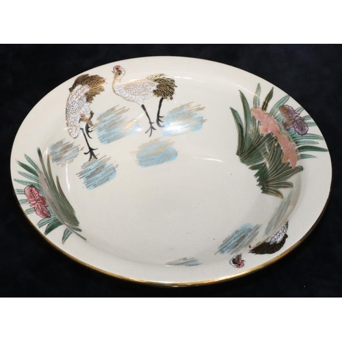 54 - A Japanese round lipped bowl on cream ground with multi-coloured bird, floral, leaf and gilt decorat... 