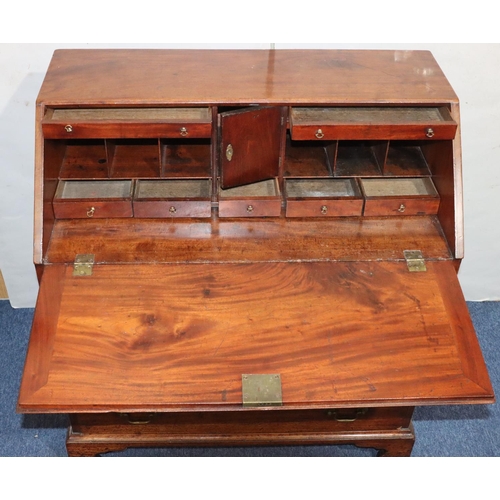 542 - A George III figured mahogany bureau with fall front enclosing fitted interior, panel door, pigeonho... 