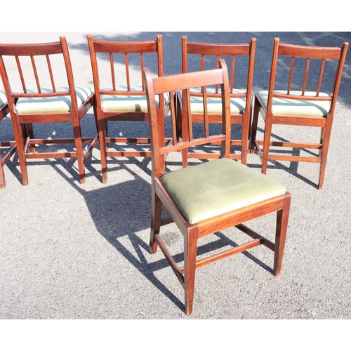 543 - A set of 6 mahogany single dining chairs with stick backs, green velvet drop in seats, on square tap... 