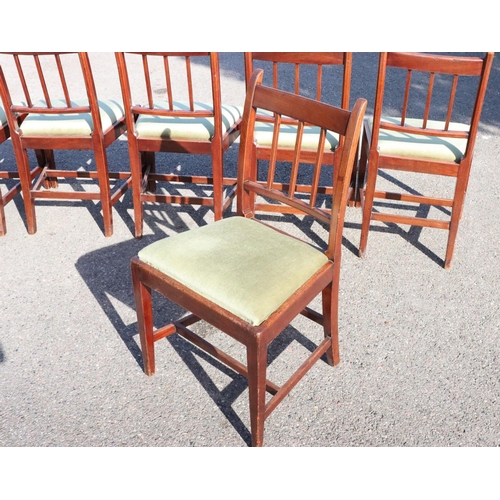 543 - A set of 6 mahogany single dining chairs with stick backs, green velvet drop in seats, on square tap... 