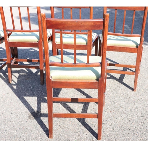 543 - A set of 6 mahogany single dining chairs with stick backs, green velvet drop in seats, on square tap... 