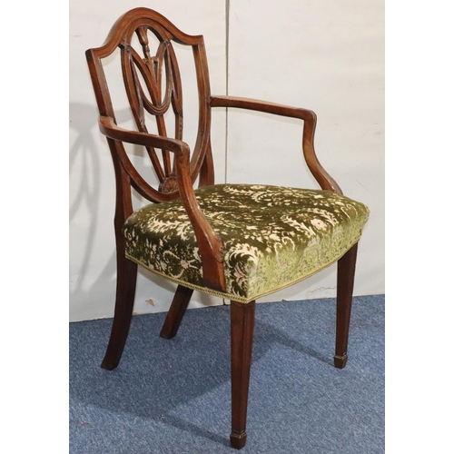 544 - A 19th Century mahogany Hepplewhite carving chair with carved pierced back, green floral velvet over... 