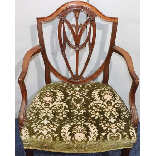 544 - A 19th Century mahogany Hepplewhite carving chair with carved pierced back, green floral velvet over... 