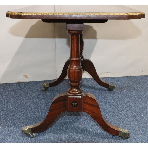 546 - A mahogany rectangular shaped coffee table with brass inlaid decoration, turned end supports with ce... 