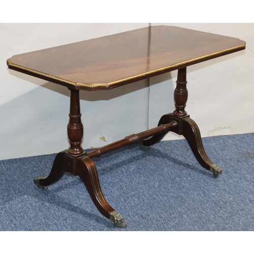 546 - A mahogany rectangular shaped coffee table with brass inlaid decoration, turned end supports with ce... 