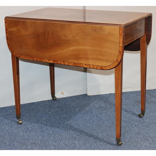 549 - A 19th Century mahogany Pembroke table with allover inlaid stringing and banding, oval centre panel,... 