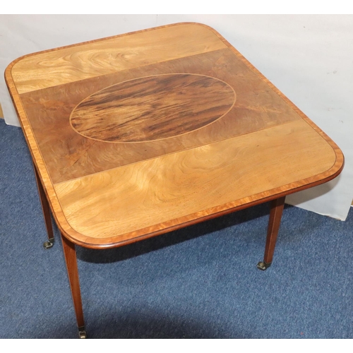 549 - A 19th Century mahogany Pembroke table with allover inlaid stringing and banding, oval centre panel,... 