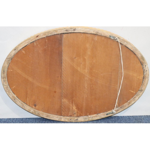 554 - An oval gilt hanging wall mirror with gadroon rim, 71.5cm high, 47.5cm wide