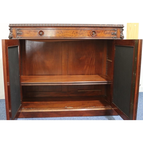 555 - A 19th Century figured mahogany chiffonier with 1 long drawer above 2 leather panelled doors with ra... 