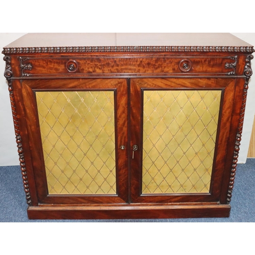 555 - A 19th Century figured mahogany chiffonier with 1 long drawer above 2 leather panelled doors with ra... 