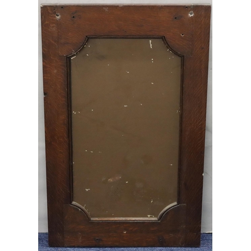 563 - A Victorian carved oak wall mirror having allover leaf and scroll decoration, 68cm x 48cm (converted... 