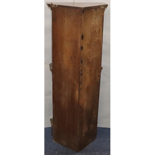 566 - A Victorian oak small low corner cupboard with single panel door with carved crest, figurehead and f... 