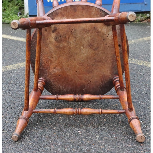 569 - A 19th Century mahogany single chair with turned stick back, circular solid seat on round turned leg... 