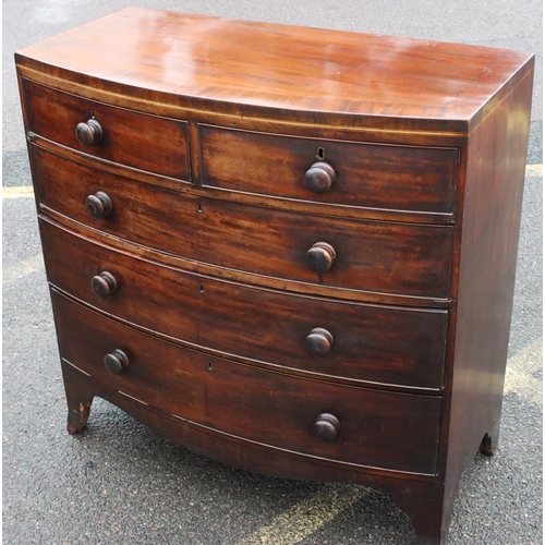 577 - A 19th Century mahogany bow fronted chest of drawers with part inlaid stringing and banding, 2 short... 