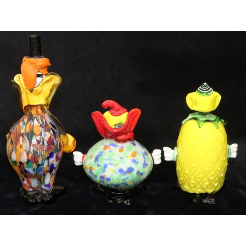 66 - A Murano glass figure of a clown on yellow ground, 24cm high and 2 other Murano glass figures of clo... 