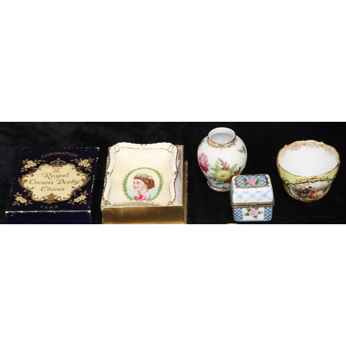 76 - A set of 4 small Continental shell shaped dishes with multi-coloured floral, leaf and gilt decoratio... 