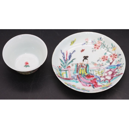 95 - A Chinese tea bowl and saucer on white ground with multi-coloured figure fence and floral decoration... 