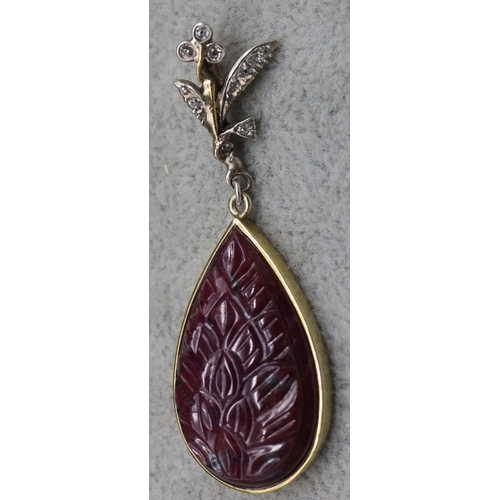 409 - A gold coloured metal drop natural ruby pear shaped pendant, mounted with small diamonds, 5cm high, ... 