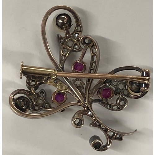 426 - An Asprey gold and silver spray brooch mounted with 3 rubies, 3 half pearls and rough cut diamonds, ... 