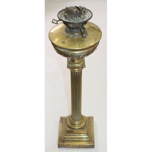 450 - A brass Corinthian column paraffin lamp with bulbous shaped bowl and embossed decoration, on square ... 