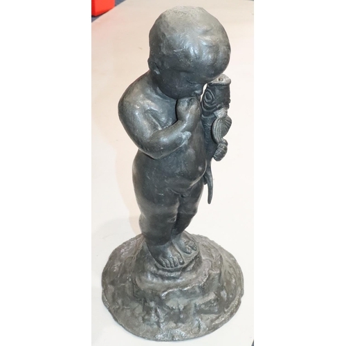 458 - A heavy lead figure of a child holding a fish on round splayed base, 53cm high