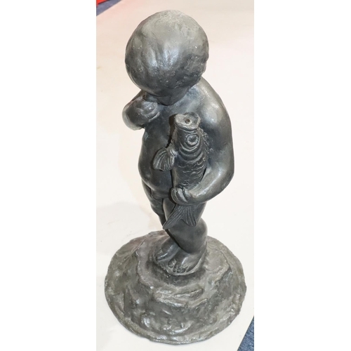 458 - A heavy lead figure of a child holding a fish on round splayed base, 53cm high