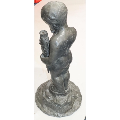 458 - A heavy lead figure of a child holding a fish on round splayed base, 53cm high