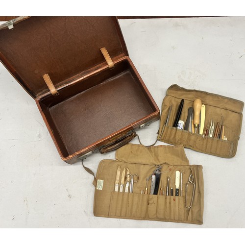 514 - 2 canvas rolls of medical and other instruments and a small leather attaché case, 37cm wide