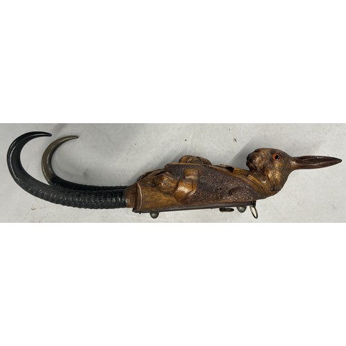 515 - A Black Forest style carved wooden musical hanging coat hook in the of a hare with glass eyes and ho... 