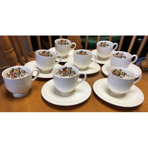 9145 - A Wedgwood coffee service on cream ground with multi-coloured floral and leaf decoration, comprising... 