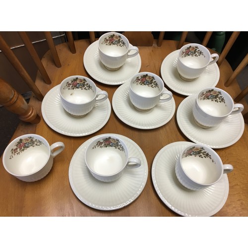 9145 - A Wedgwood coffee service on cream ground with multi-coloured floral and leaf decoration, comprising... 