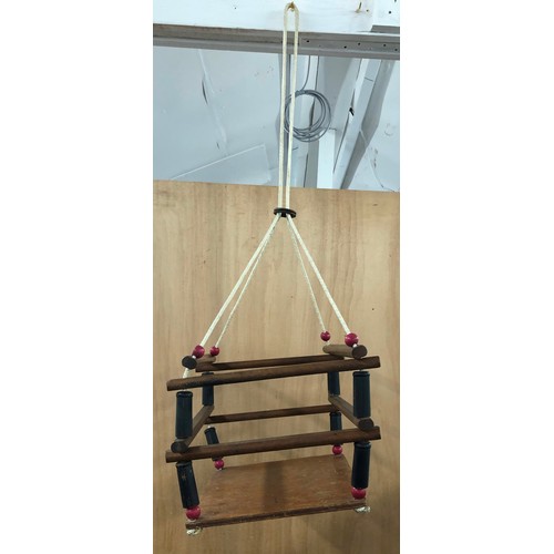 9287 - A vintage wooden child's swing, seat 30cm x 25cm.