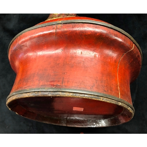 9003 - An Oriental wood box with half lid, red painted with gilt detail, 30cm high. (Some splits to wood on... 