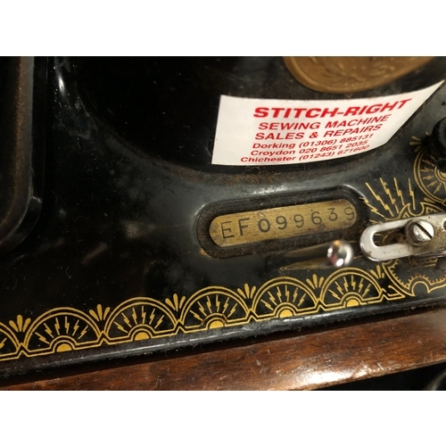 9050 - An electric Singer sewing machine No. K5935823, Serial No. EF099639 with accessories, pedal and cabl... 