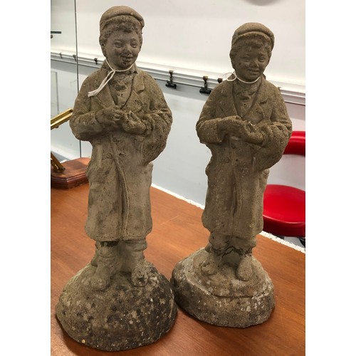 9295 - A pair of concrete small garden figures of standing boys, 44cm high