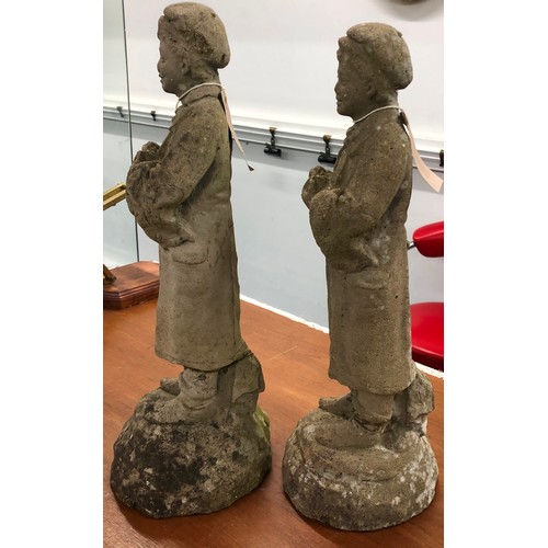 9295 - A pair of concrete small garden figures of standing boys, 44cm high