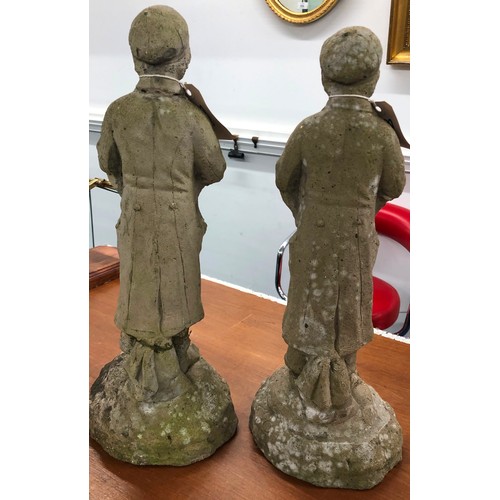 9295 - A pair of concrete small garden figures of standing boys, 44cm high