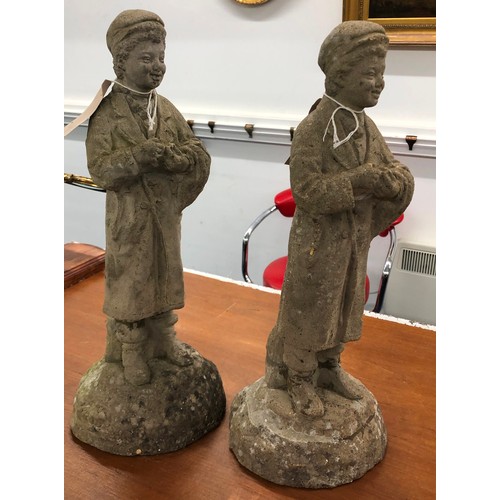 9295 - A pair of concrete small garden figures of standing boys, 44cm high