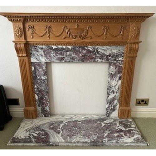 9192 - A pine fireplace with red and white marble base, raised urn, swag, ribbon and reeded decoration, fir... 