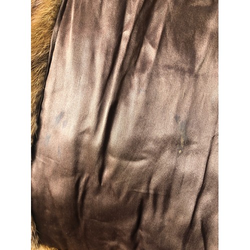 9060 - A brown short mink fur jacket, labelled Theodore Roach, 67cm long, sleeve 62cm long (hole in 1 sleev... 