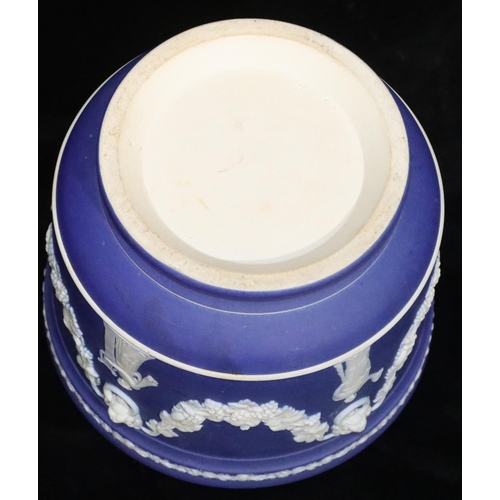 5 - A Wedgwood Jasperware round jardinière on blue and white ground with raised grape, vine, swag and fi... 