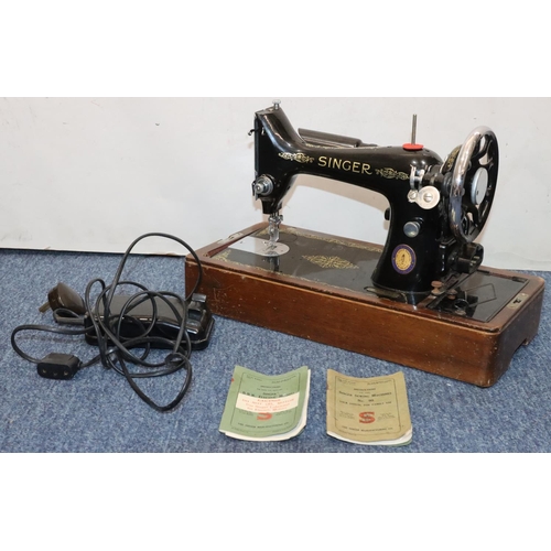 480 - A Singer 99K electric sewing machine with motor (cased), with accessories and instruction books