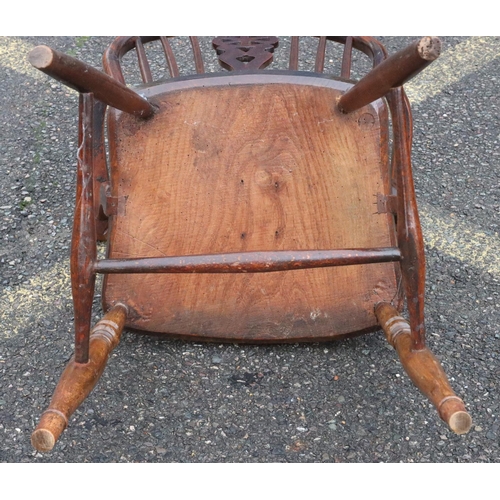 571 - A 19th Century yew and elm wheel and stick back armchair with solid seat on round turned legs and st... 