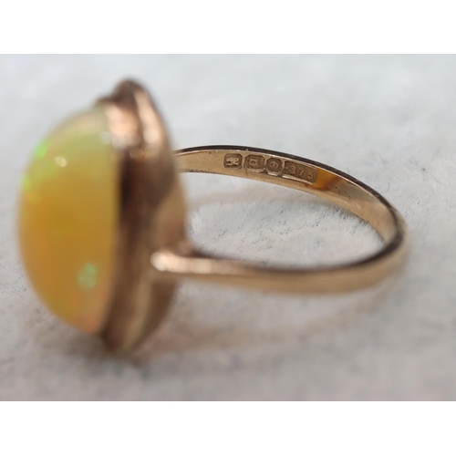 407 - A 9ct gold ladies' oval opal ring, Size L, 2.9 grams gross