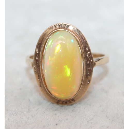 407 - A 9ct gold ladies' oval opal ring, Size L, 2.9 grams gross