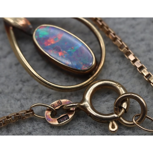 413 - A gold oval black opal pendant with square 9ct gold chain, 4.9 grams gross