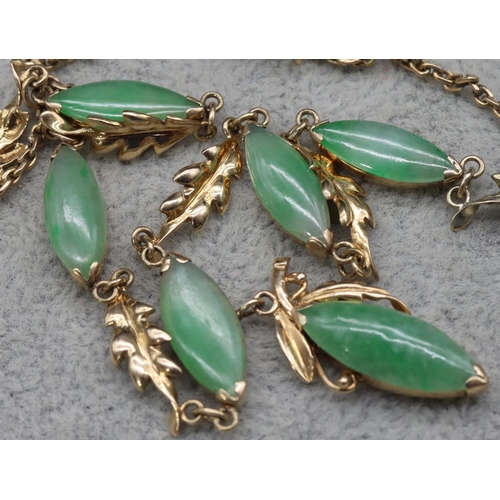 414 - A gold and jade drop necklace, 46cm long, 10.7 grams gross